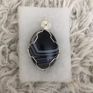 Stone charm wrapped in silver